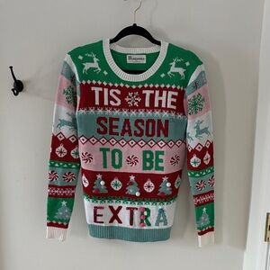 Multicolored “No Boundaries” sweater, size small.